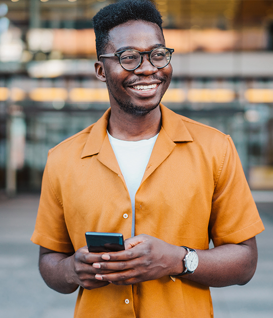 man smiling and looking around